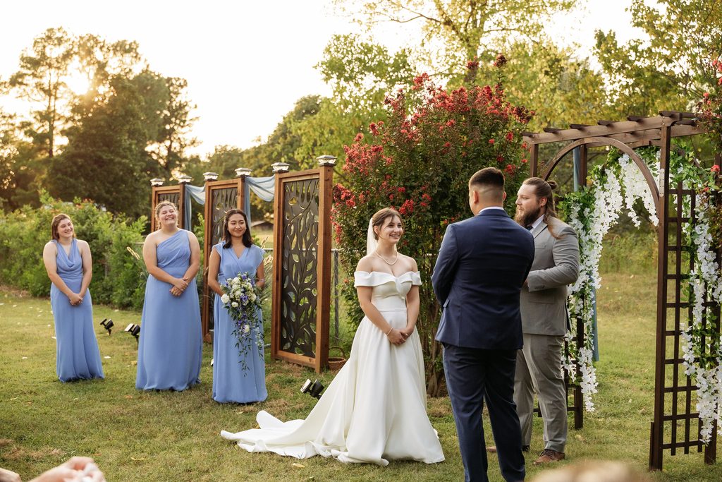 Groom's first look reaction at outdoor Oklahoma wedding ceremony