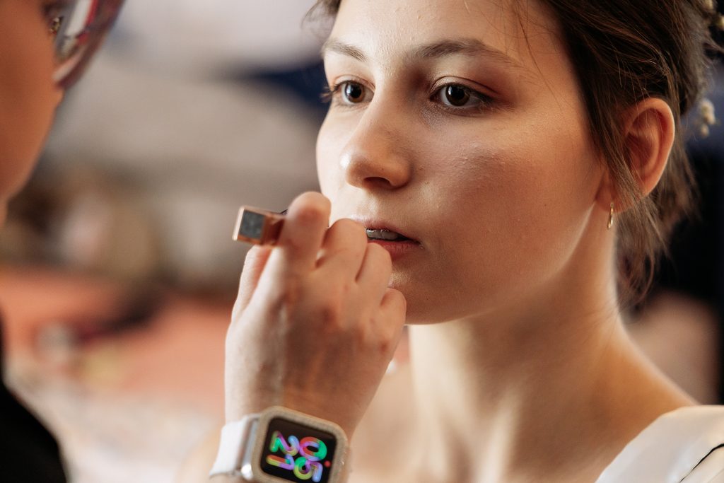 Bride getting ready in her childhood bedroom before Oklahoma backyard wedding.